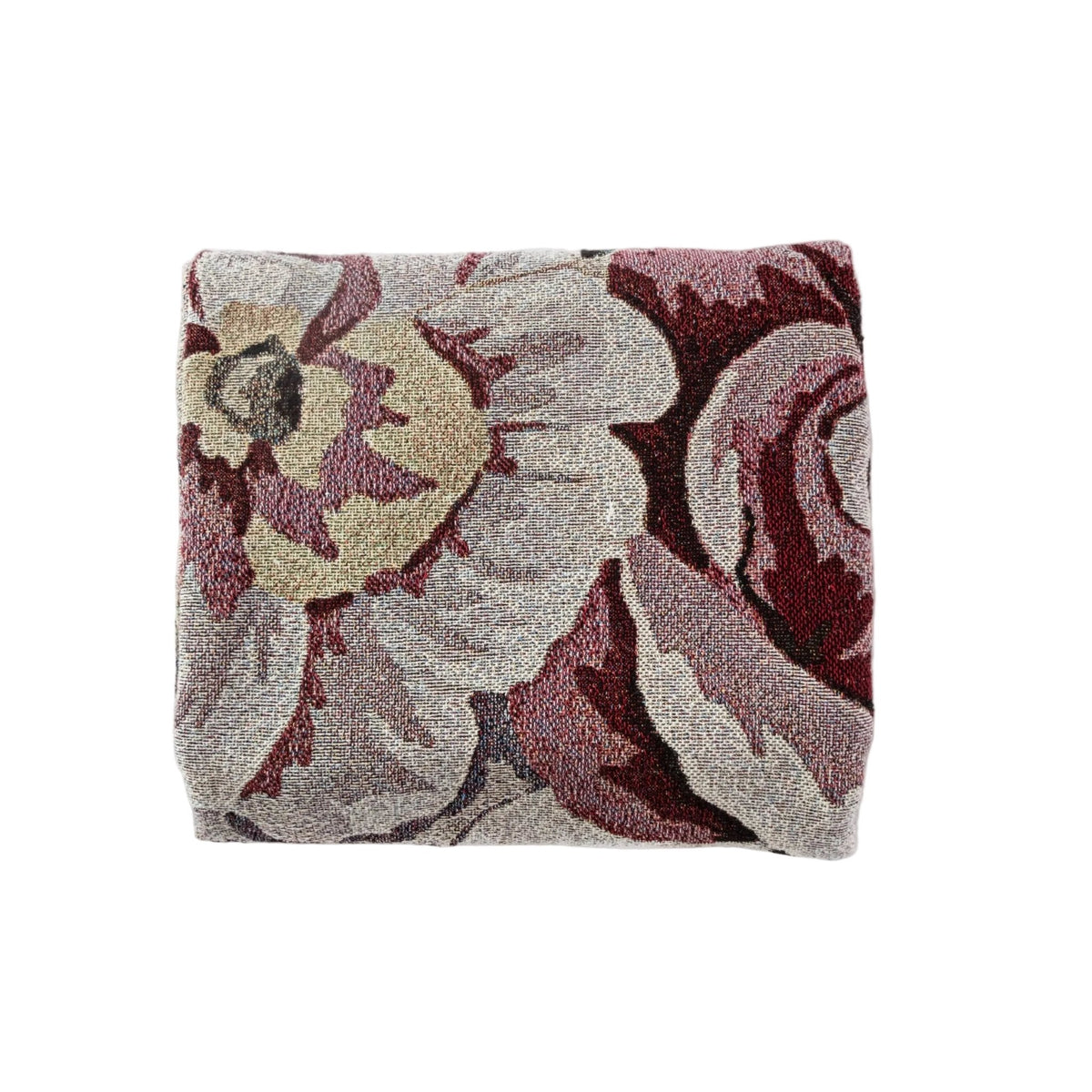 Meadow woven blanket featuring a floral design in shades of burgundy and cream, neatly folded.