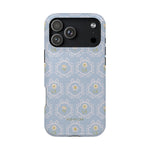 Merrigold iPhone case featuring a light blue floral pattern with intricate designs and a black camera cutout.