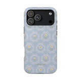 Merrigold iPhone case featuring a light blue floral pattern with intricate designs and a black camera cutout.