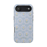 Merrigold iPhone case featuring a light blue floral pattern with green and white accents on a protective shell.