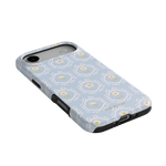 Merrigold iPhone case featuring a light blue floral pattern with yellow accents and a black edge.