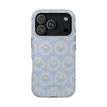 Merrigold iPhone case featuring a light blue floral pattern with intricate designs and a glossy finish.