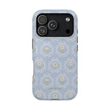 Merrigold iPhone case featuring a light blue floral pattern with intricate designs and a glossy finish.