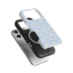 Merrigold iPhone case featuring a light blue floral design, stacked above a black and silver phone case.
