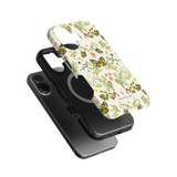 Monarch iPhone case featuring a floral and butterfly design in white, with a black case underneath.