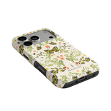 Monarch iPhone case featuring a floral design with butterflies in yellow and green on a white background.