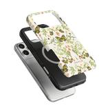 Monarch iPhone case featuring a floral design with butterflies, layered over a black and silver phone case.