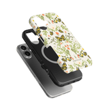 Monarch iPhone case featuring a floral design with butterflies in vibrant colors, layered over a black phone case.