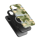 Orchard iPhone case featuring a green and beige tree pattern, layered over a black phone case with a circular cutout.