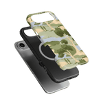 Orchard iPhone case featuring a green and beige landscape design with trees, layered over a black phone.