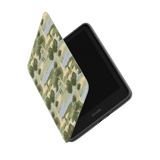 Orchard Kindle case with a camouflage pattern, partially open, displaying the Kindle device inside.
