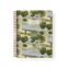 Orchard notebook featuring a landscape design with trees and water, spiral binding, and a beige label on the cover.
