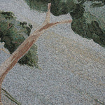 Orchard woven blanket featuring a detailed tree design with green leaves and a textured background.