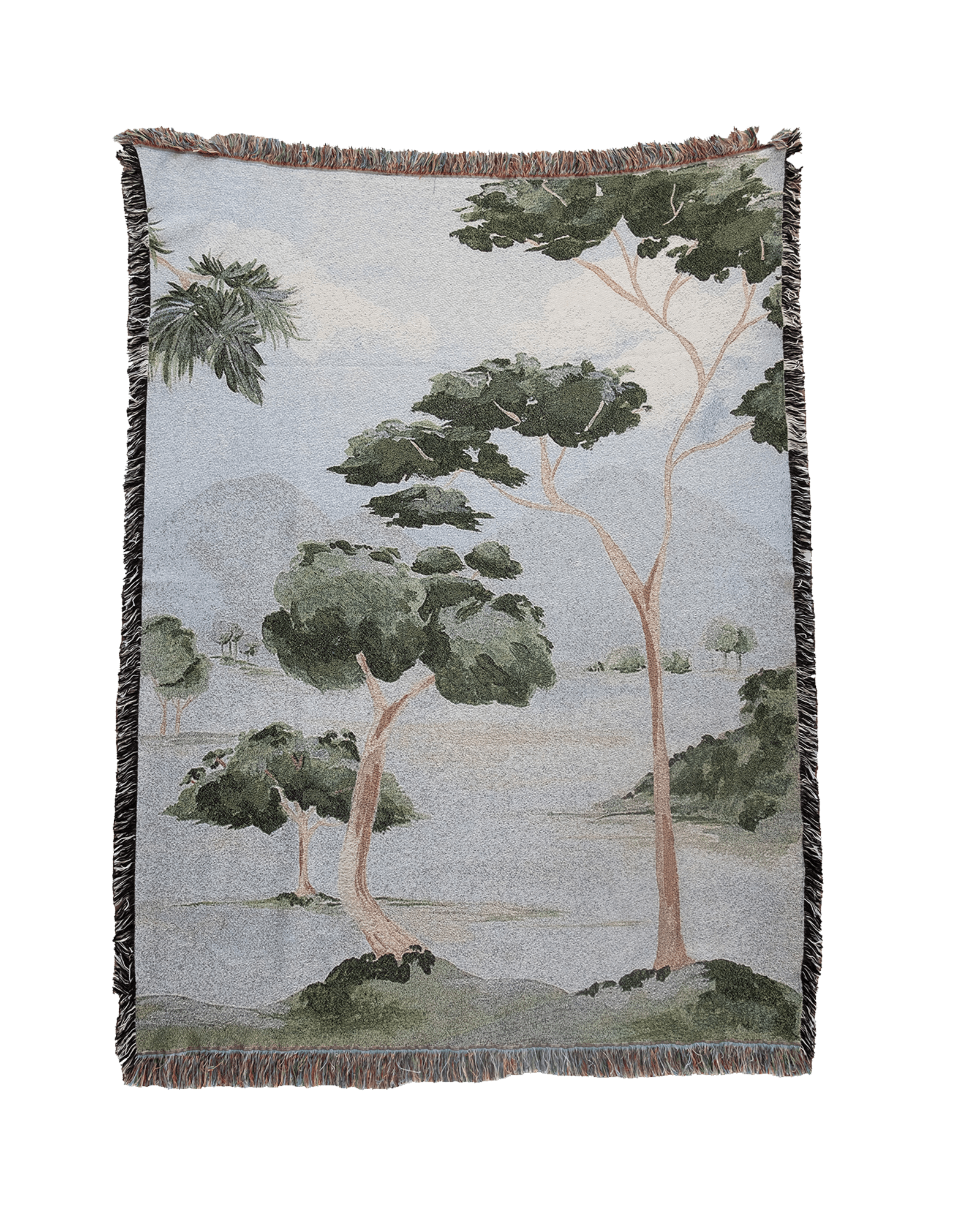 Orchard woven blanket featuring a landscape design with trees and mountains in muted green and beige tones.