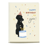 Otis birthday card featuring a black dog wearing a party hat next to a cake with candles and colorful confetti.
