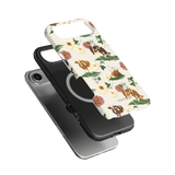 Pasture iPhone case featuring a floral design with cows, layered over a black phone case.