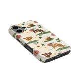 Pasture iPhone case featuring floral patterns and illustrations of cows in earthy tones on a light background.