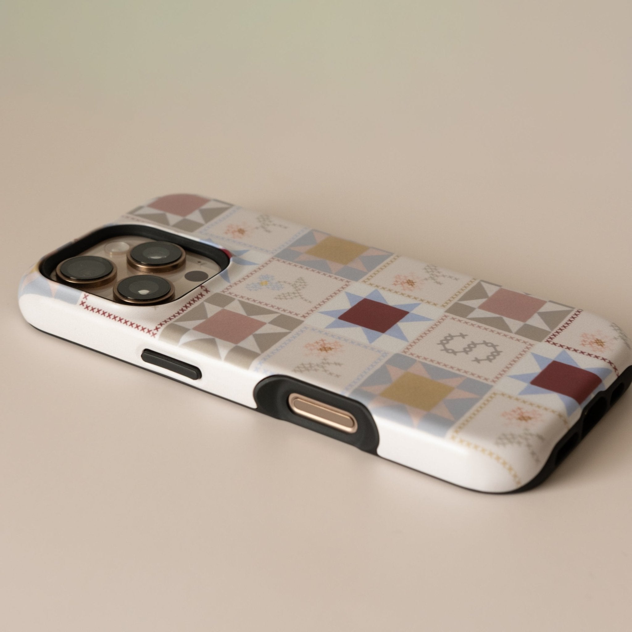 Patchwork personalized iPhone case featuring a colorful geometric design with various patterns and textures.