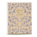 Penelope wedding card featuring floral patterns in blue on a beige background with the text "officially off the market.