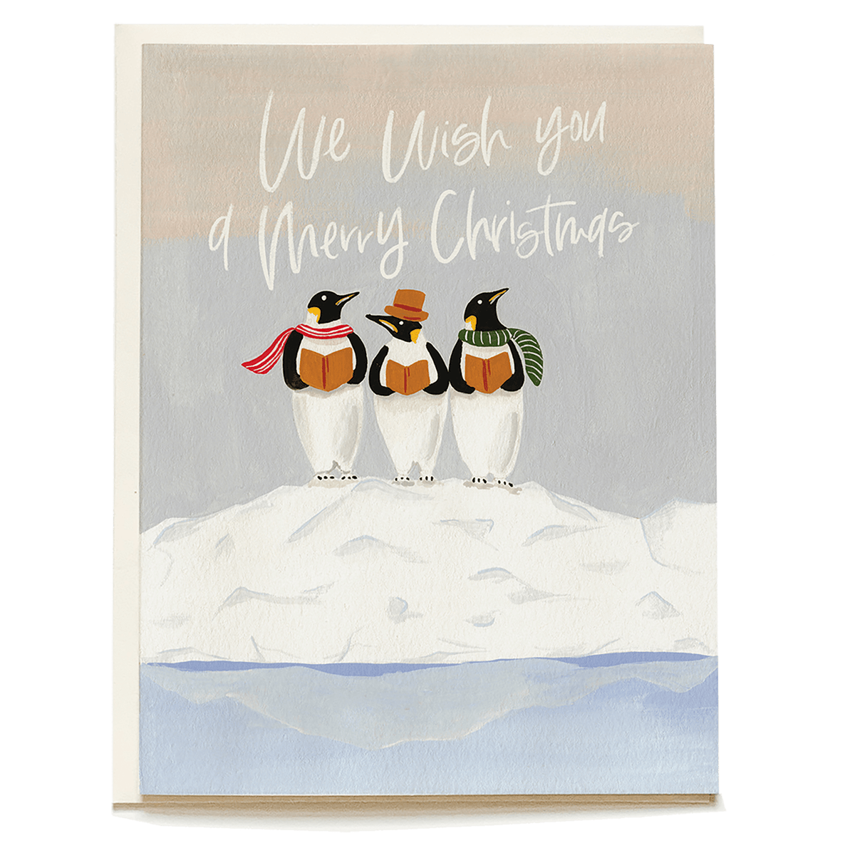 Three penguins wearing scarves and a hat stand on a snowy mound, with "We wish you a Merry Christmas" written above.