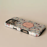 Posy personalized iPhone case featuring a floral design with a pink monogram on a light background.