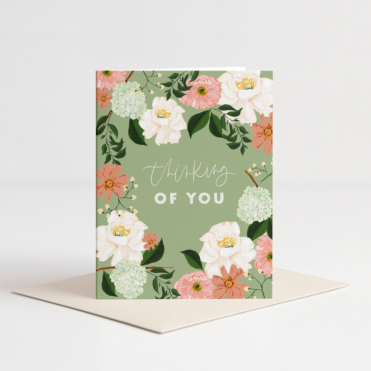 Sage Rose Sympathy Card standing on a pale pink envelope