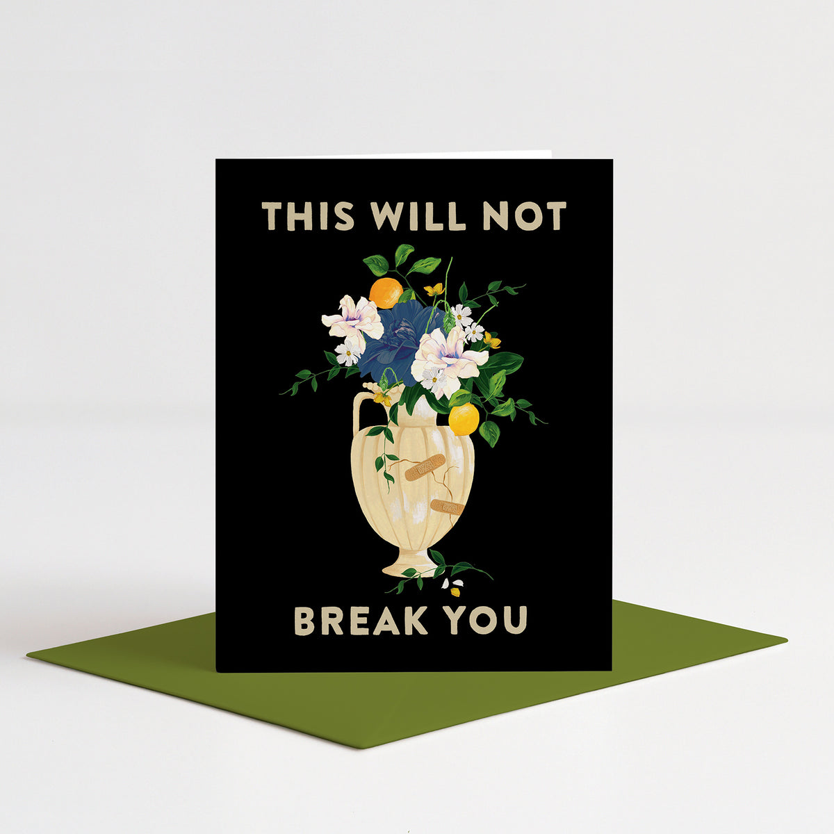 Mended Vessel Sympathy Card standing on a green envelope