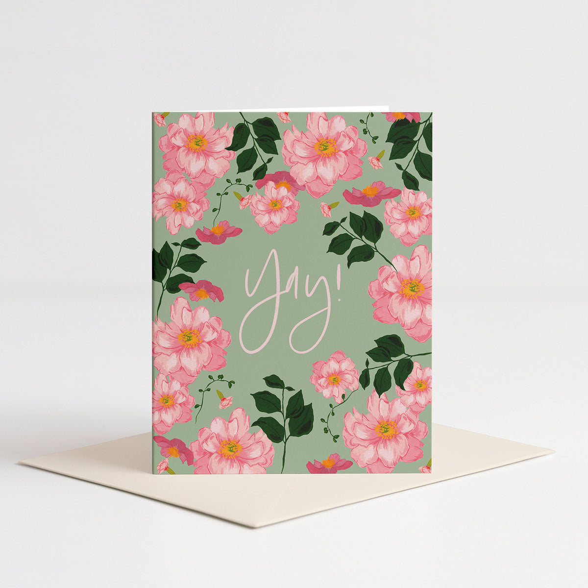 Cecile Congrats Card standing on a pale pink envelope