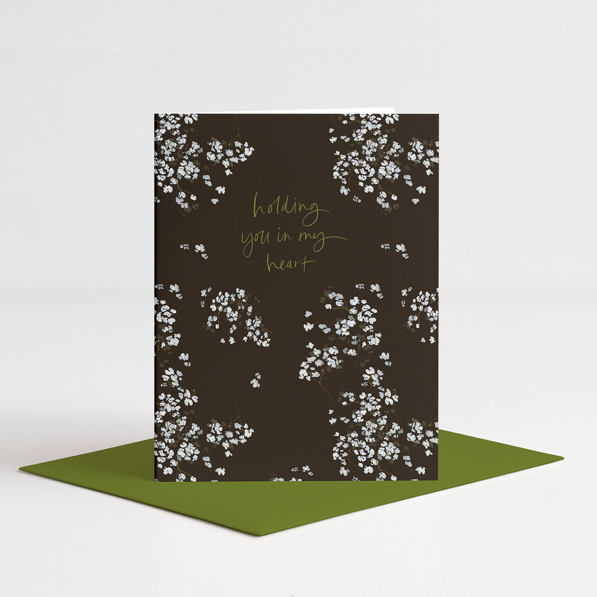 Baby's Breath Sympathy Card standing on a green envelope