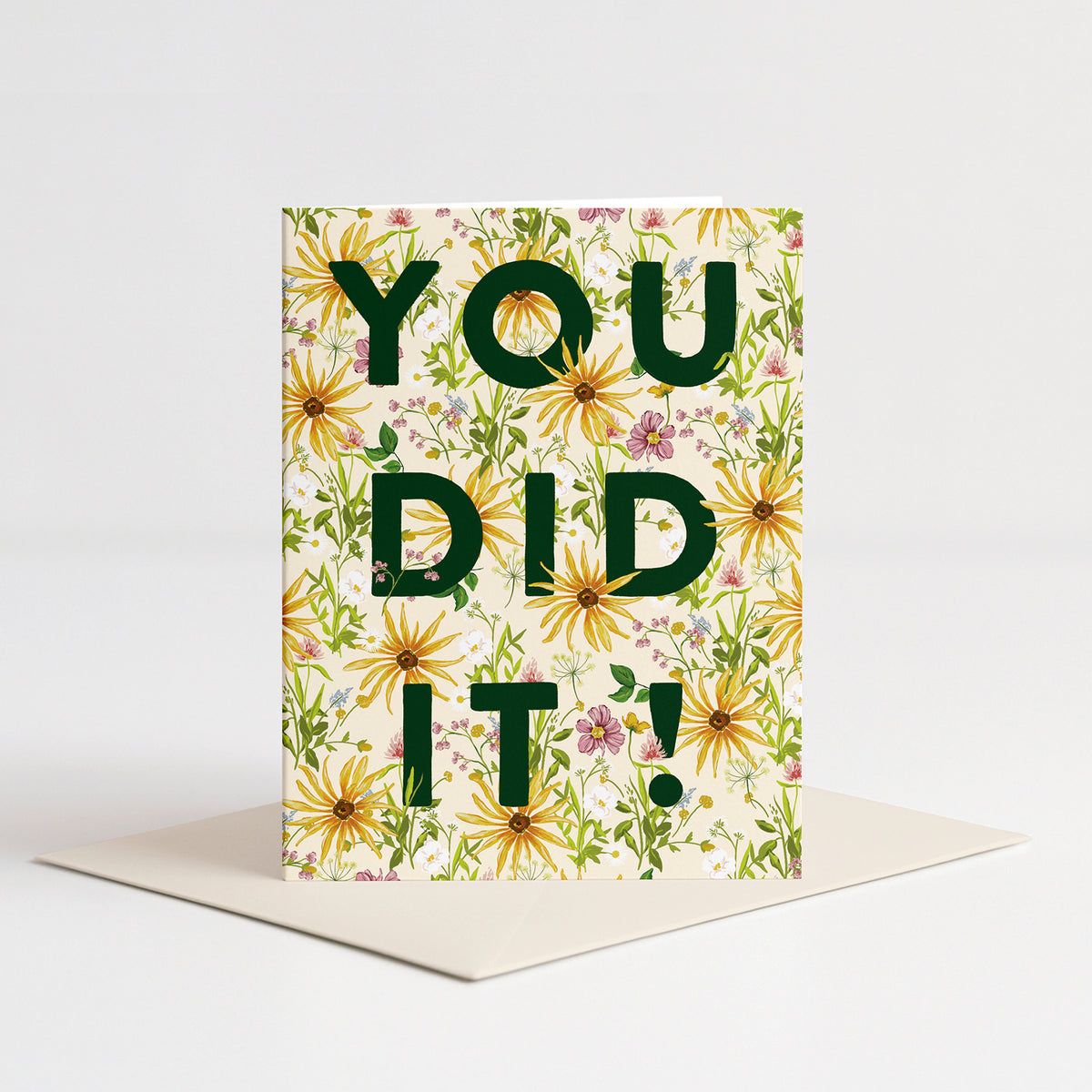 Wildflower Congrats Card standing on a pale pink envelope