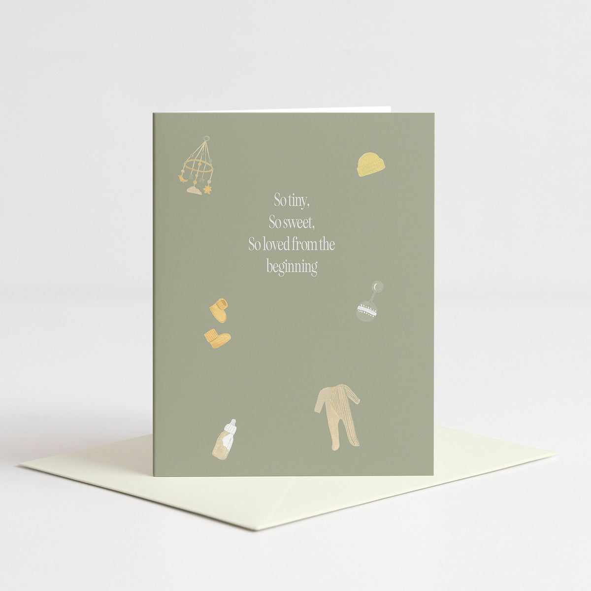 So Loved Baby Card standing on a natural cream envelope