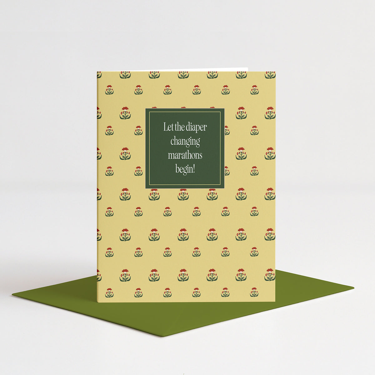 Emile Baby Card standing on a green envelope