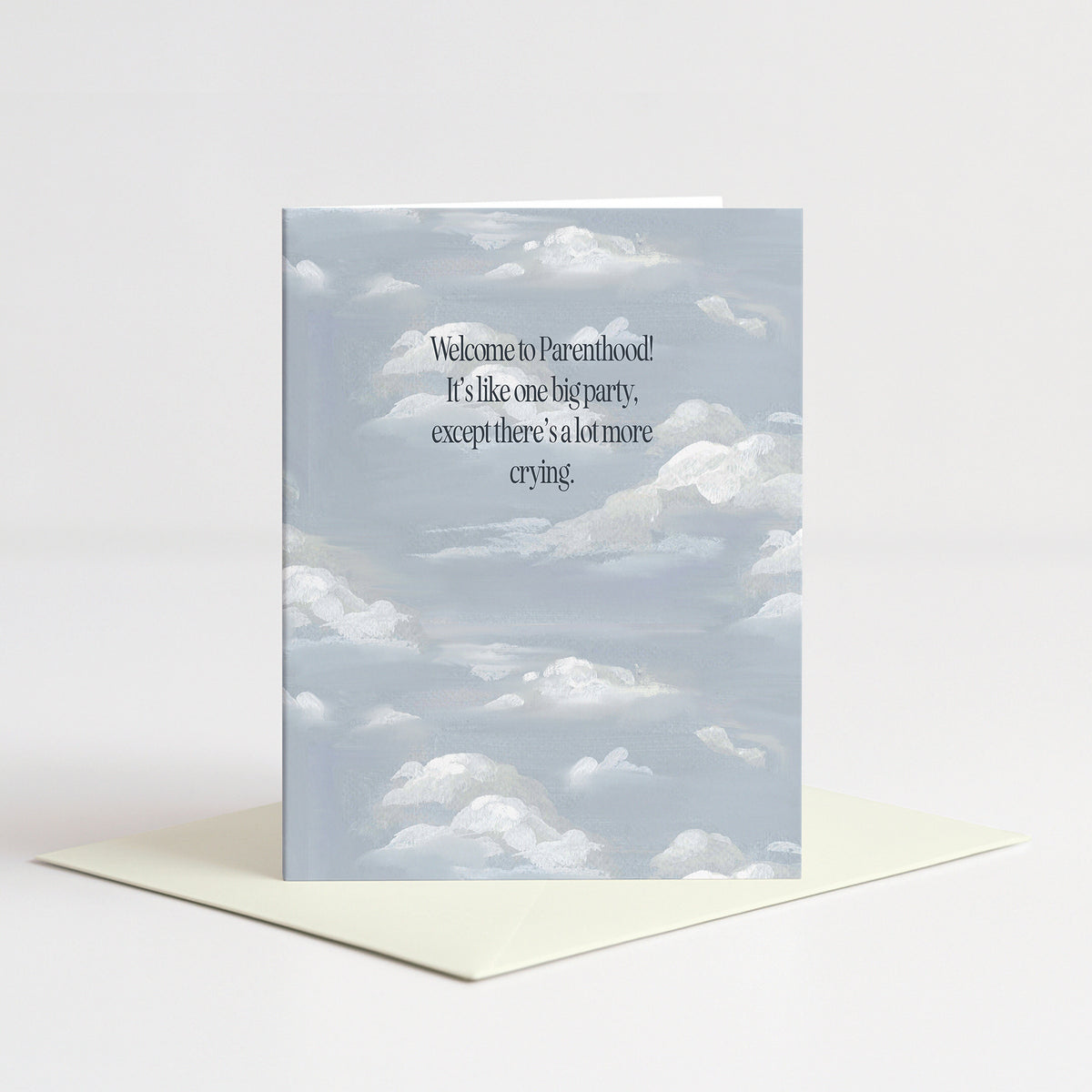 Clouds Baby Card standing on a natural cream envelope