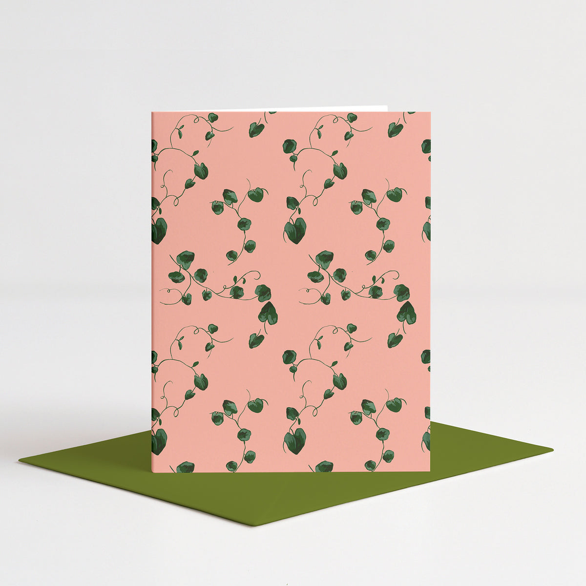 Ladybugs Blank Card standing on a green envelope