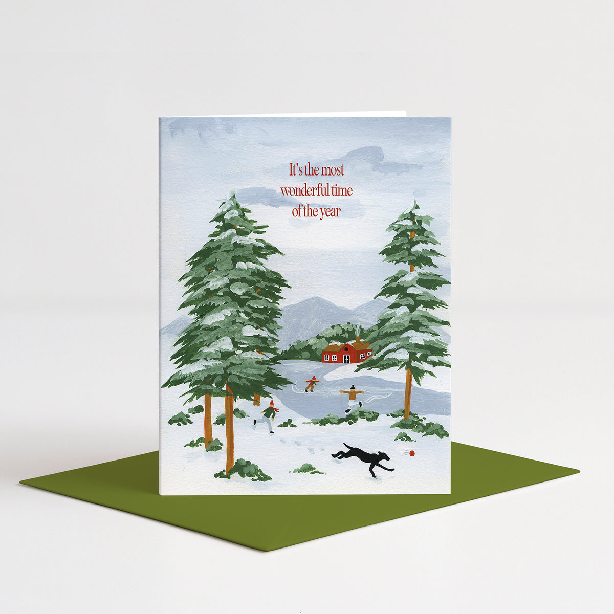 Snow Day Holiday Card standing on a green envelope