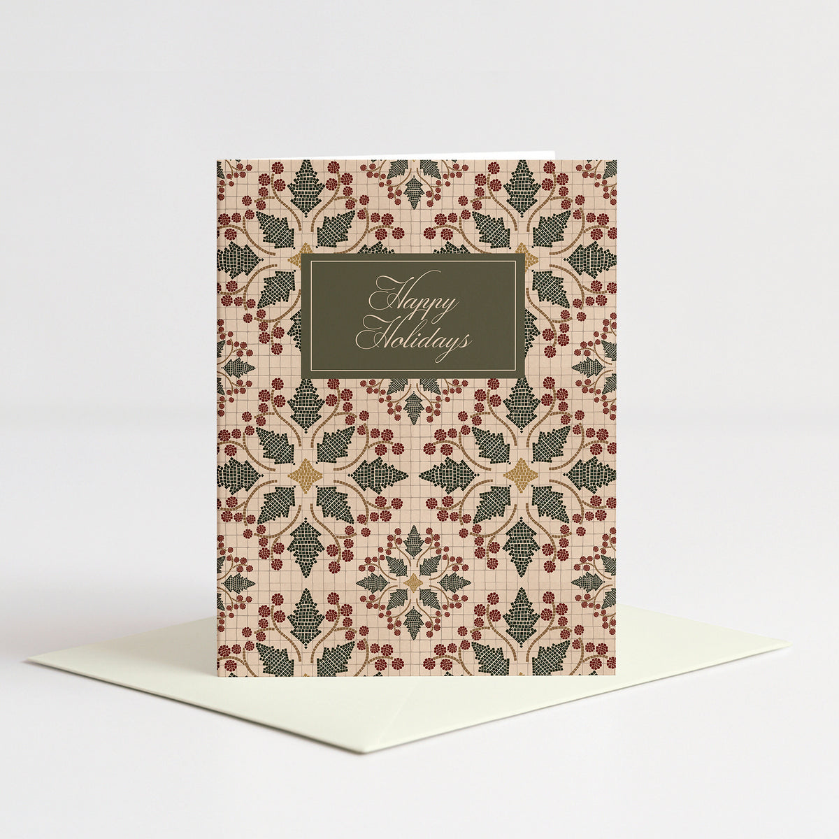 Mosaic Holly Holiday Card standing on a natural cream envelope