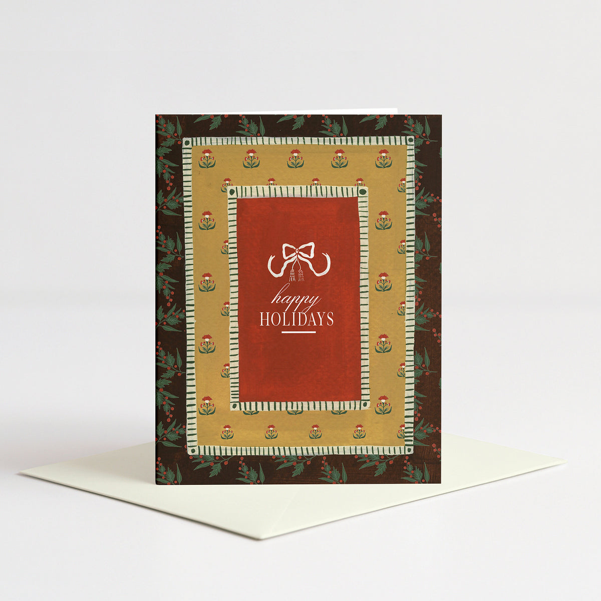 Yuletide Holiday Card standing on a natural cream envelope