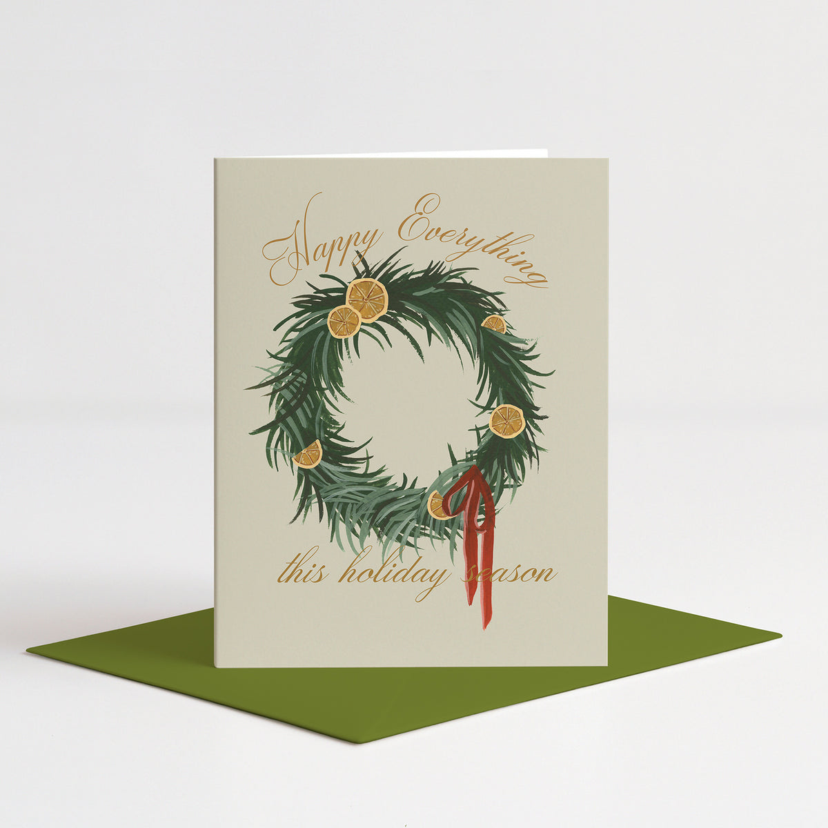 Orange Wreath Holiday Card standing on a green envelope