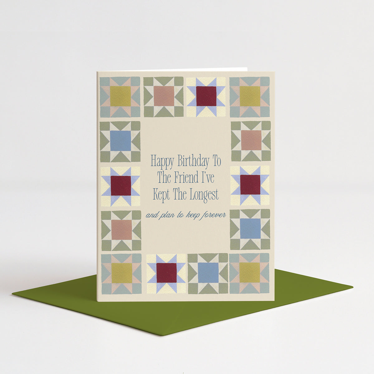 Patchwork Birthday Card standing on a green envelope