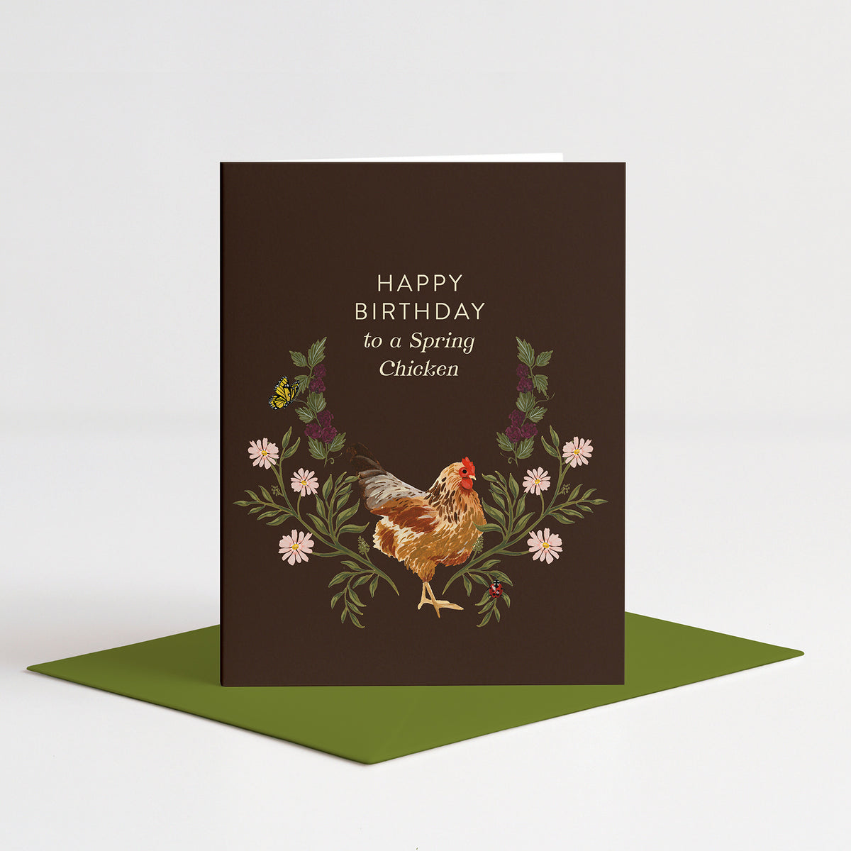 Spring Chicken Birthday Card standing on a green envelope