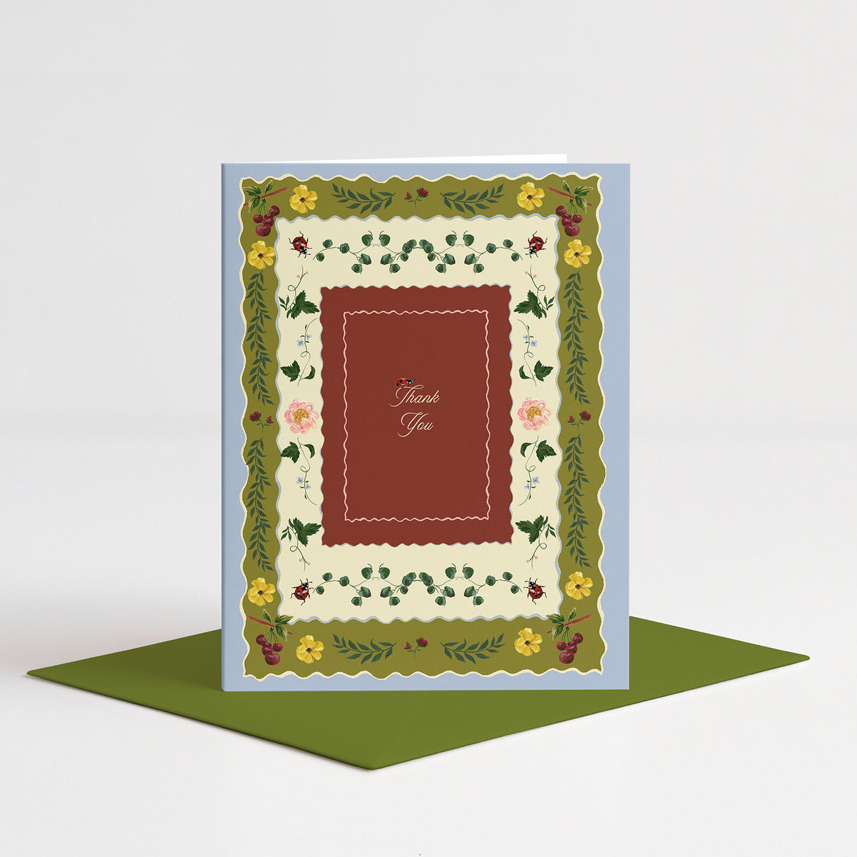 Briar Thank You Card standing on a green envelope