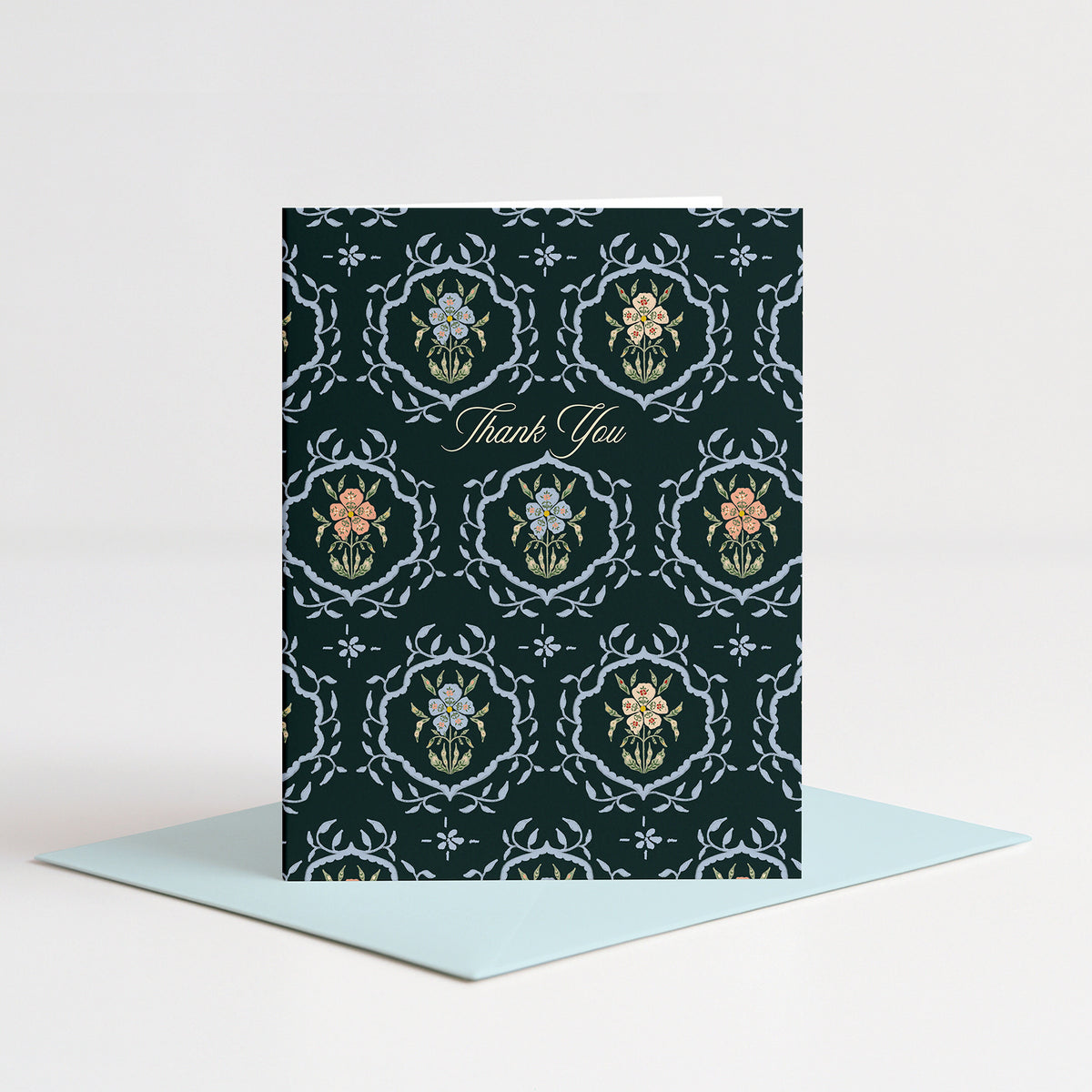 Flourish Thank You Card standing on a light blue envelope