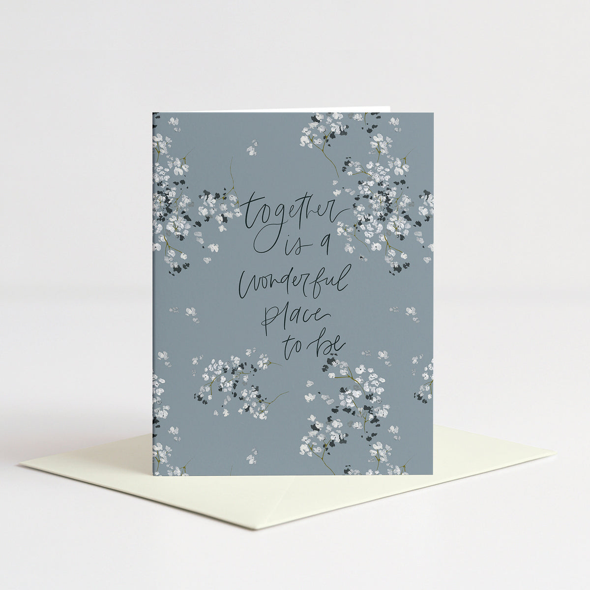 Baby's Breath Wedding Card standing on a natural cream envelope