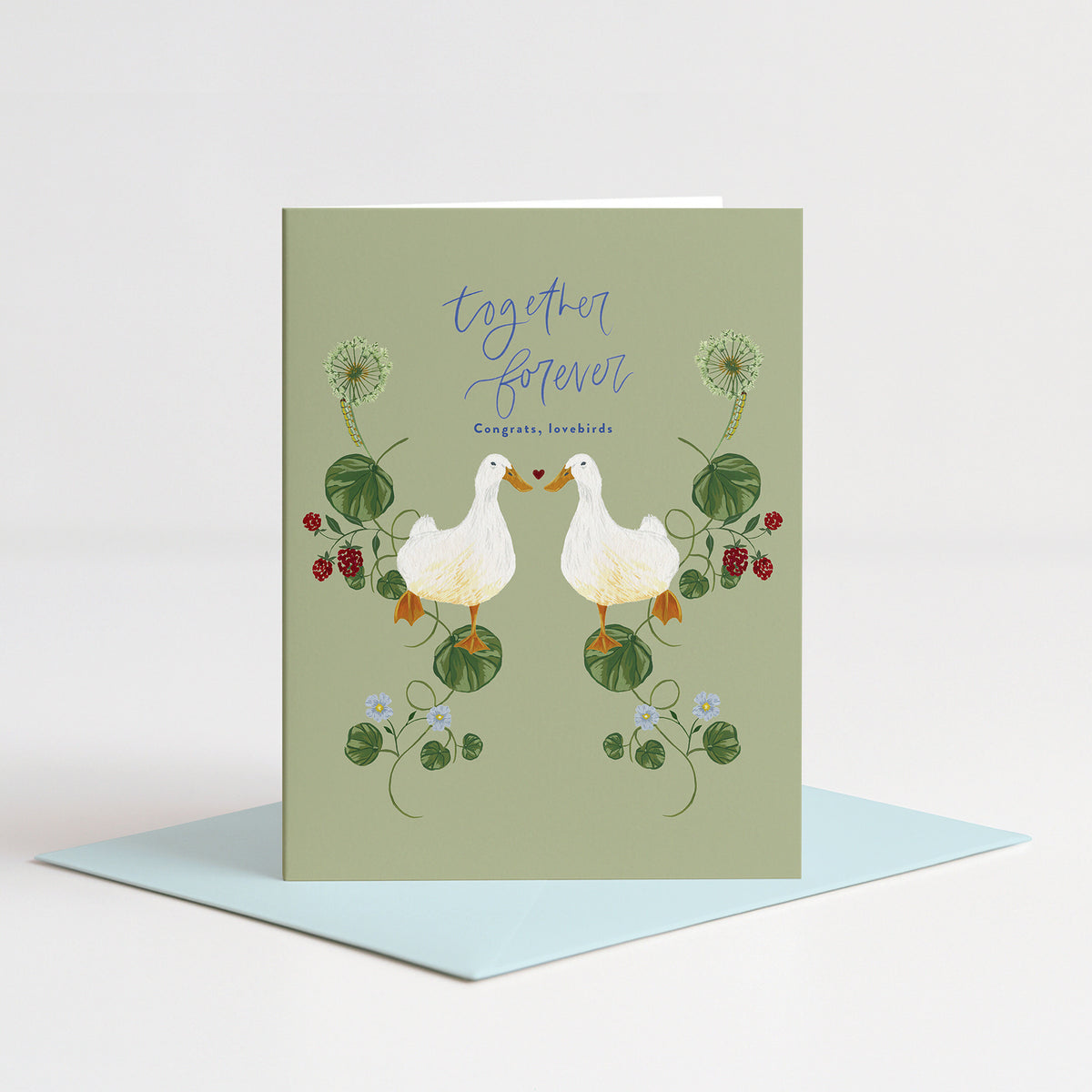 Lovebirds Wedding Card standing on a light blue envelope