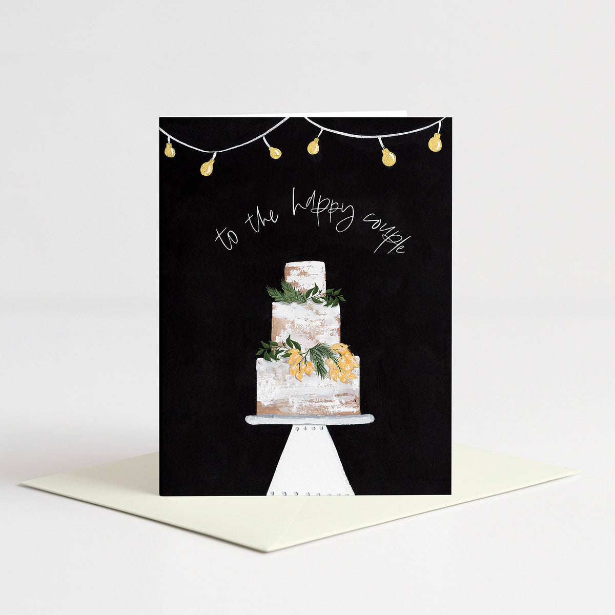 Decorative Cake Wedding Card standing on a natural cream envelope