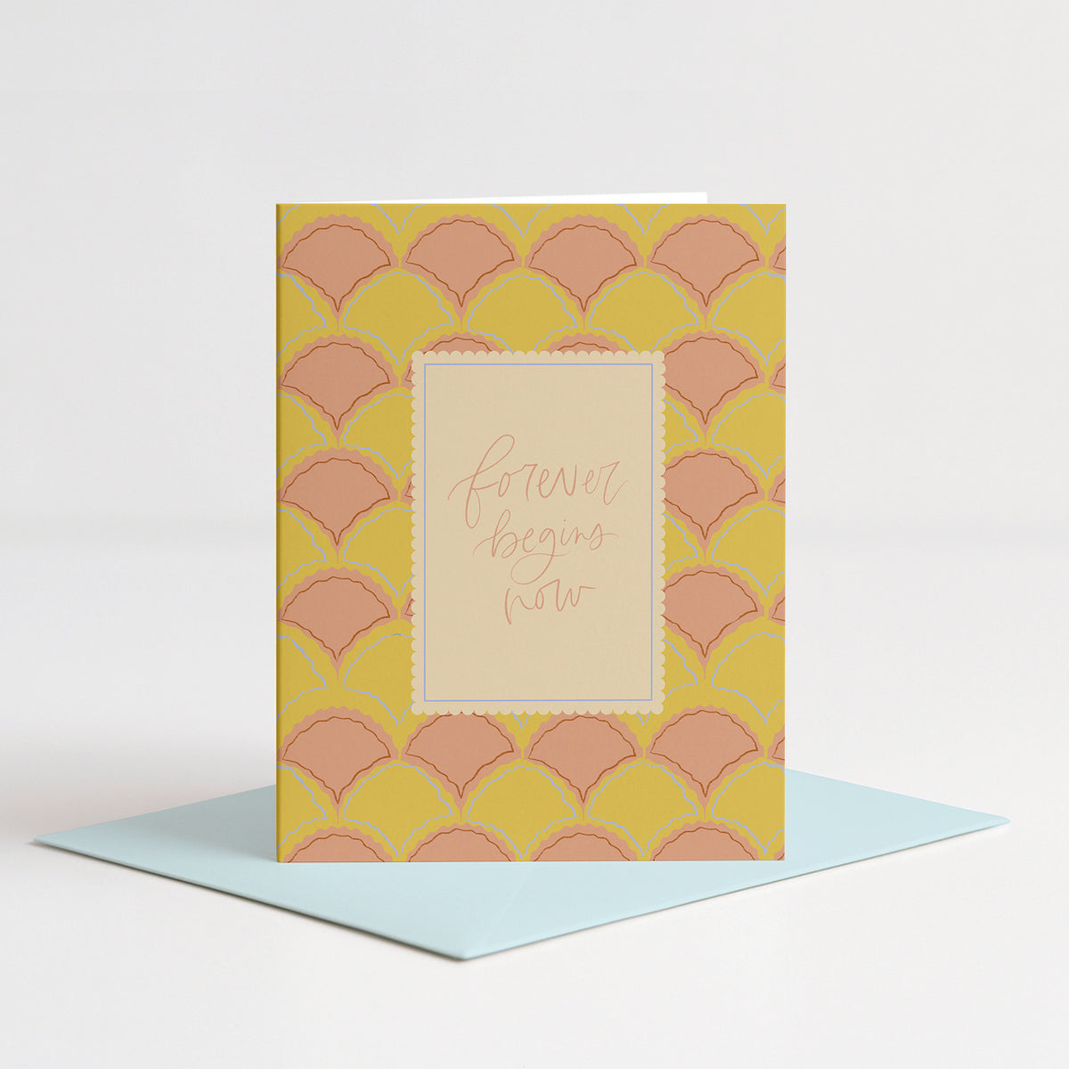 Scallops Wedding Card standing on a light blue envelope