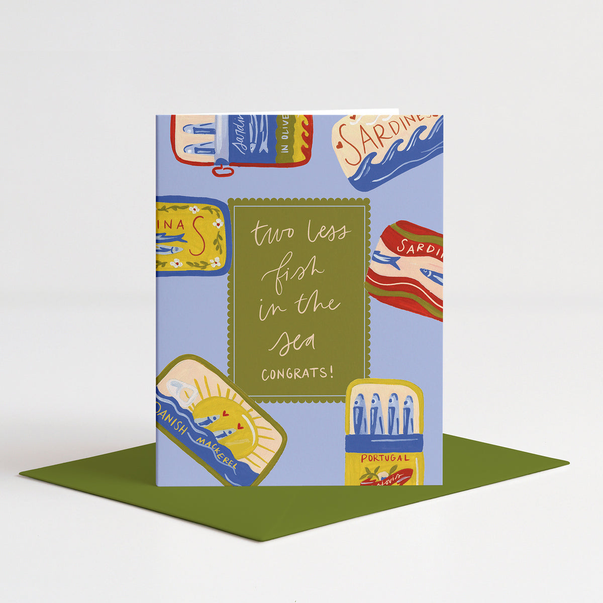 Sardines Wedding Card standing on a green envelope