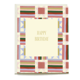 Quilt birthday card featuring a colorful geometric pattern with a central "Happy Birthday" message in gold.