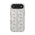 Riviera iPhone case featuring a floral pattern in blue and white with a sleek black edge.