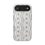 Riviera iPhone case featuring a floral pattern in blue and white with a sleek black edge.